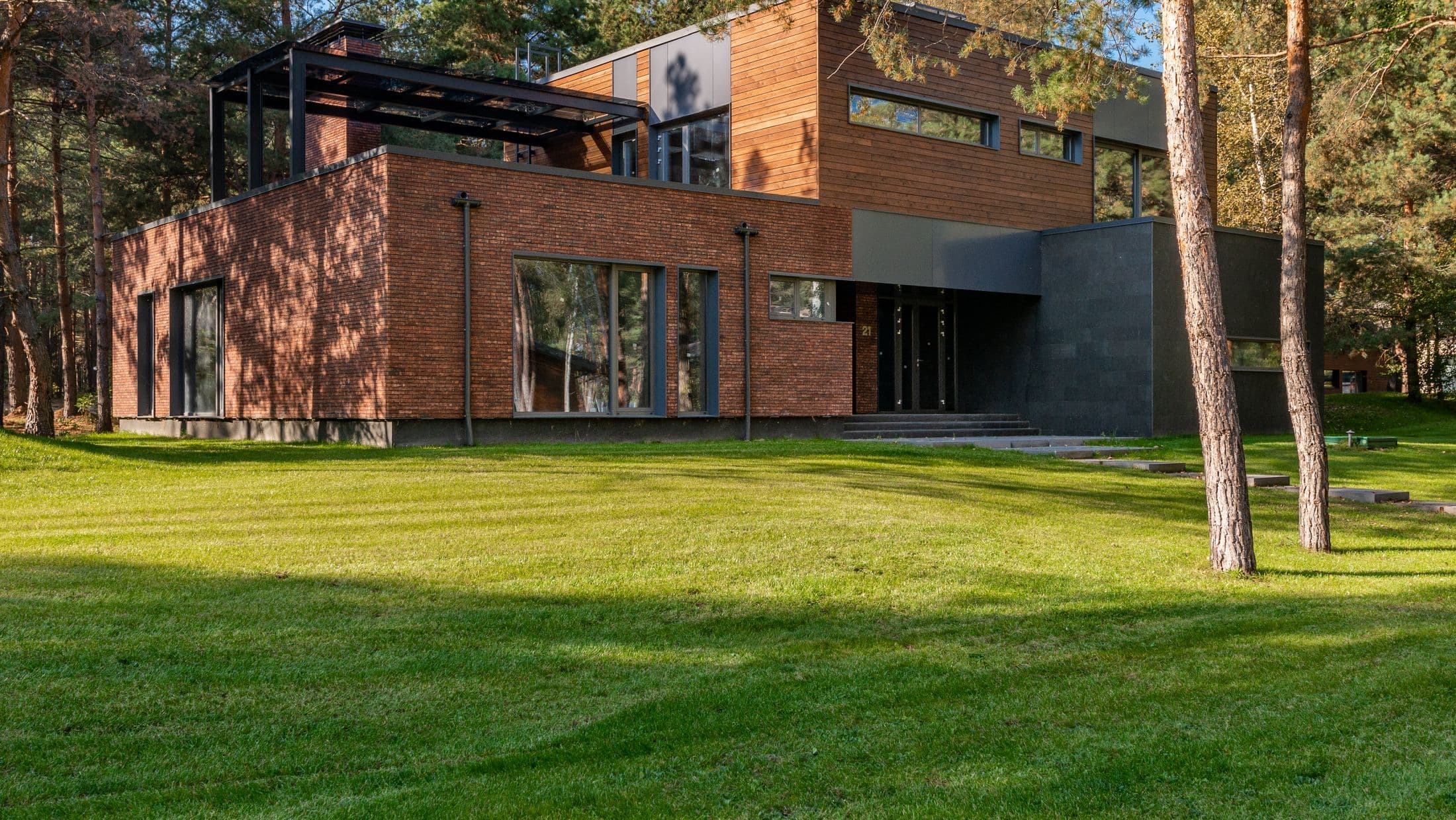 Modern custom home exterior at golden hour